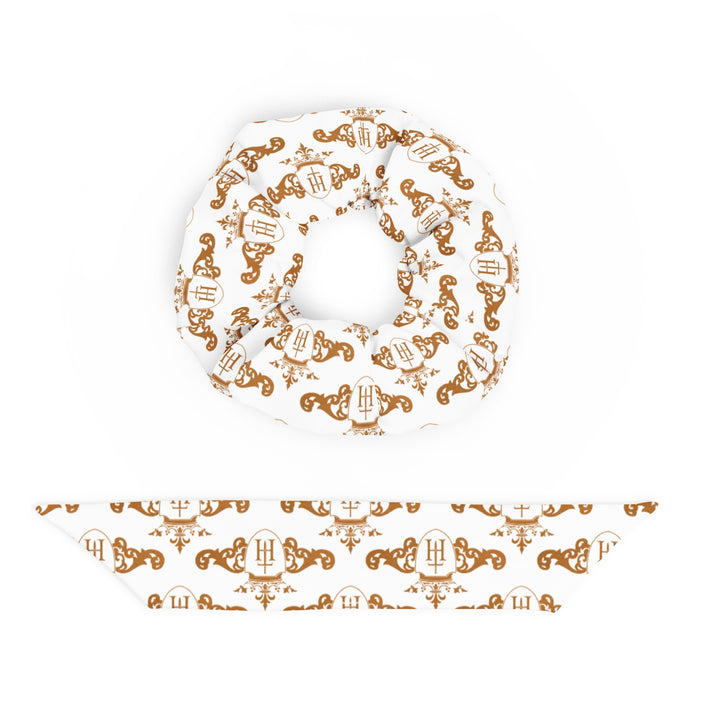 Decorative plate with intricate gold crest patterns on a white background