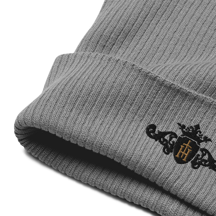 Organic Ribbed Beanie | Embroidered Black Crest with Gold Center