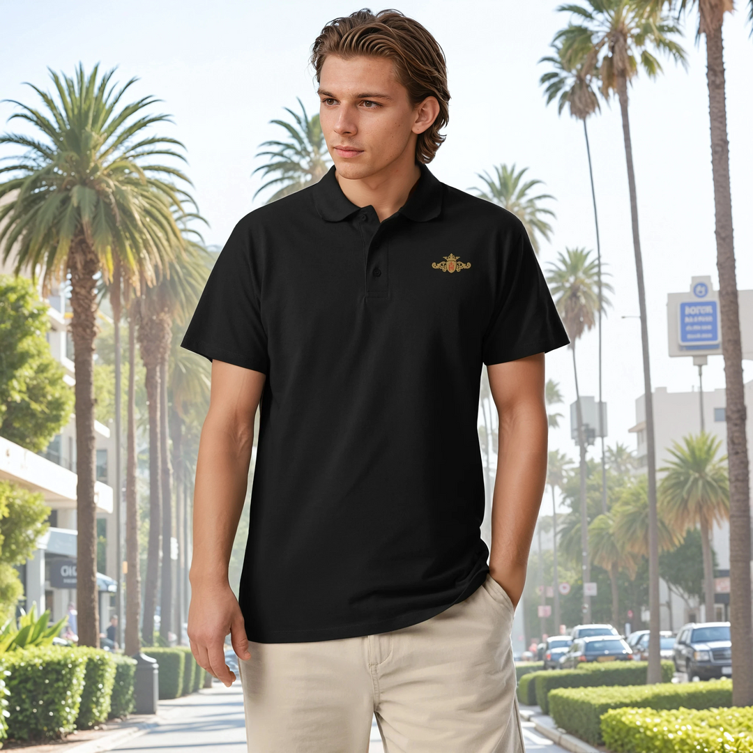 Man wearing a black polo shirt with a gold and rest crest in front of palm trees